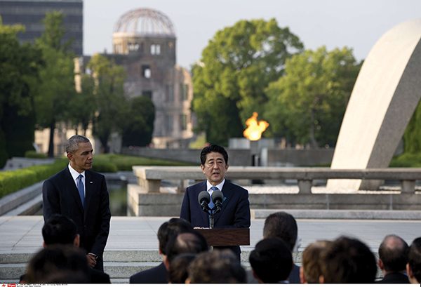 U.S. President Barack Obama, left, looks to Japanese Prime Minister Shinzo Abe as he speaks during a ceremony at the cenotaph at Hiroshima Peace Memorial Park in Hiroshima, western, Japan, Friday, May 27, 2016. Obama on Friday became the first sitting U.S. president to visit the site of the world's first atomic bomb attack, bringing global attention both to survivors and to his unfulfilled vision of a world without nuclear weapons. Atomic Bomb Dome is seen in the background. (AP Photo/Carolyn Kaster)
/OTKCK126/753952204211/
/1605281947